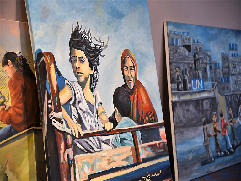 Two paintings from Bethlehem Beyond the Wall exhibition.